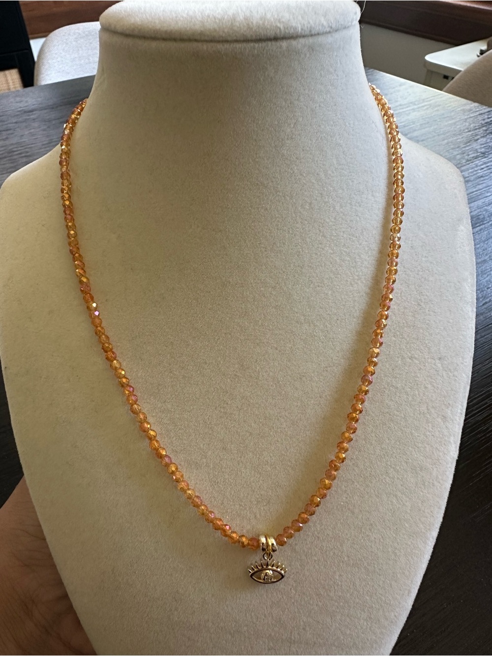 Iridescent Amber Beaded Necklace with Gold Eye Charm Pendant
